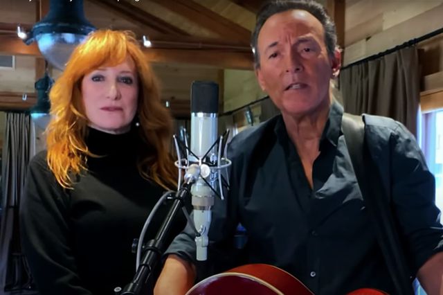 A photo of Bruce Springsteen and Patti Scialfa performing at the Jersey 4 Jersey benefit
